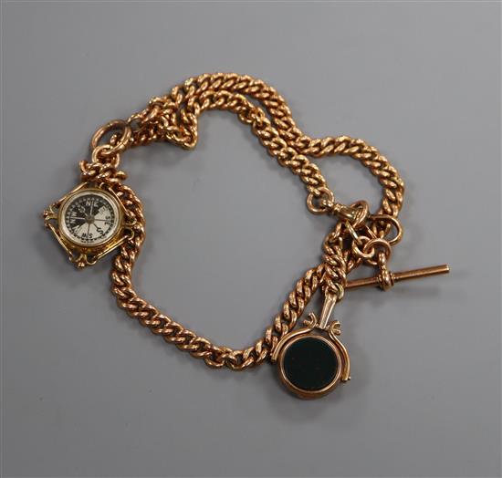 A 9ct gold curb-link watch chain with compass fob and fob seal.